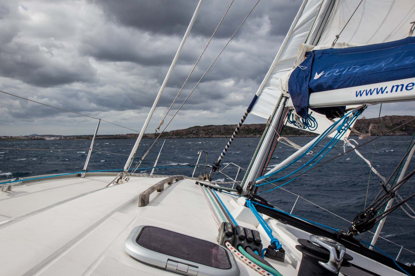 Sailing for the day along the coast of Menorca, Spain
