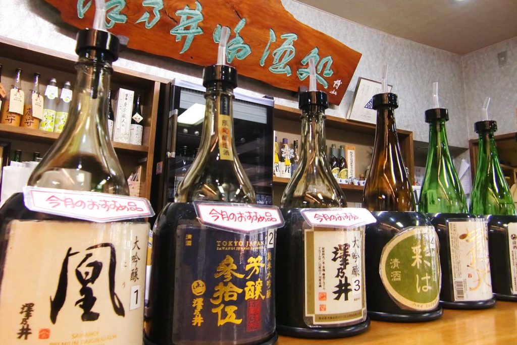 A picture containing indoor, wall, table, bottle Description automatically generated
